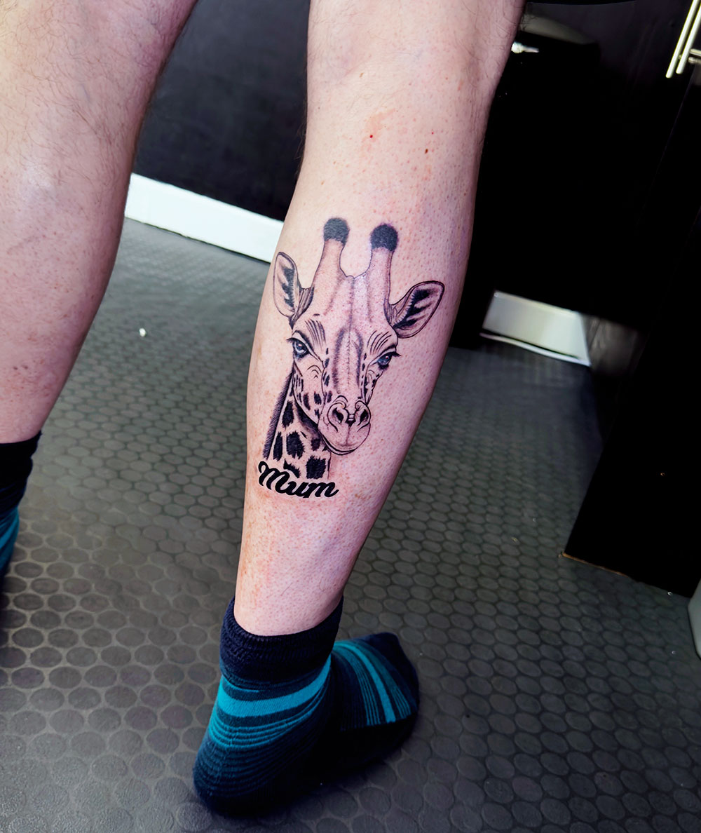 Giraffe tattoo by Inklab