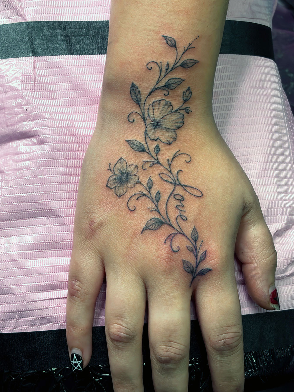 Floral Hand Fineline tattoo by Inklab